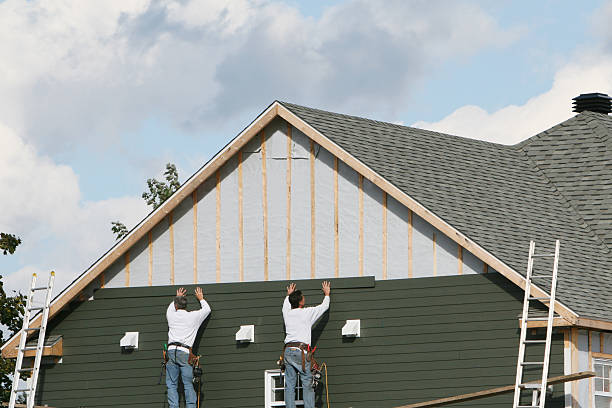 Professional Storm Damage Siding Repair technician working in Westmont, IL